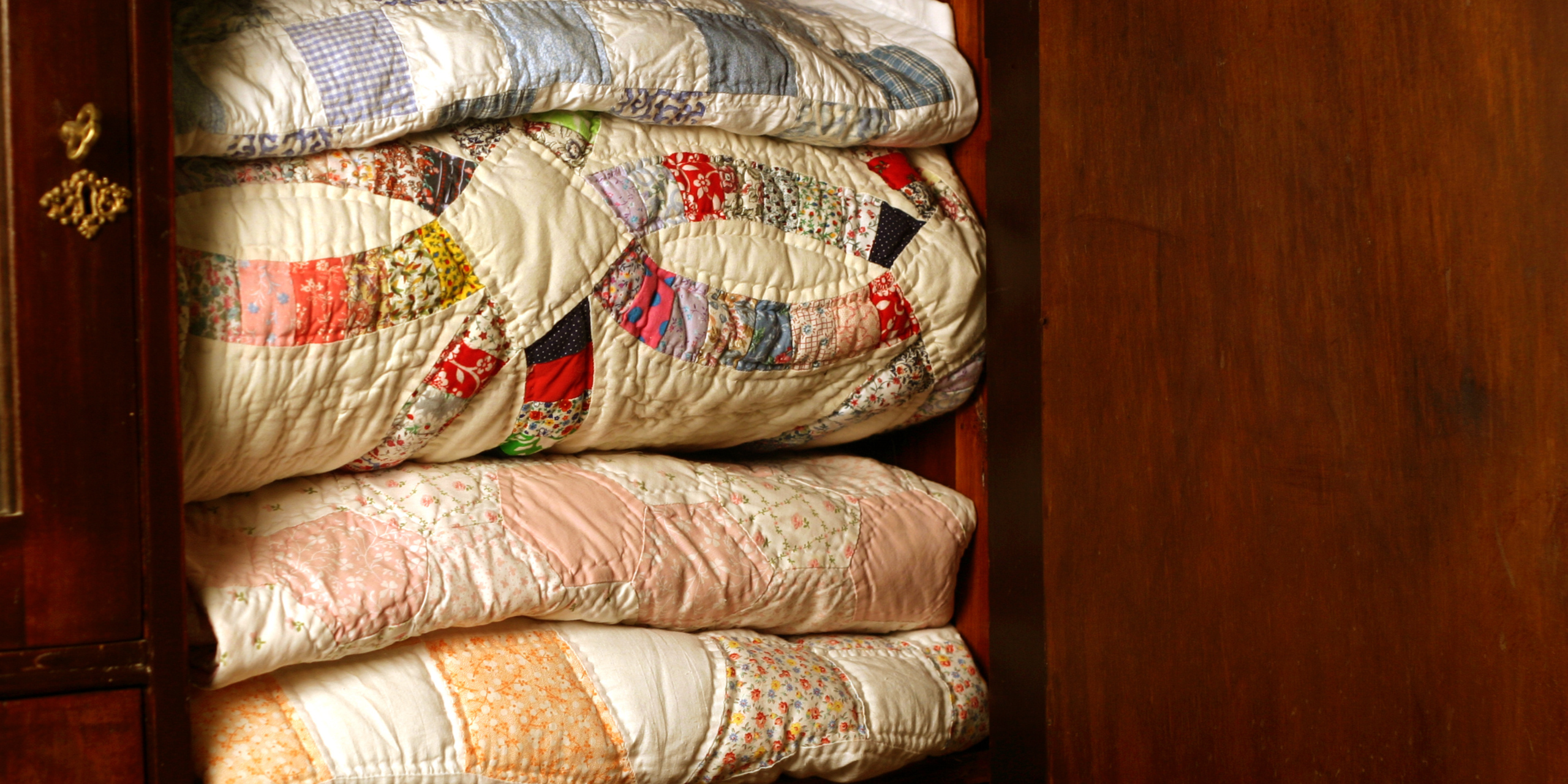 Heirloom quilt representing faith in action passed from one generation to the next